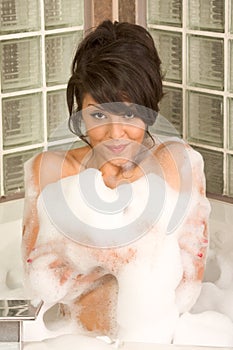 Attractive young gorges woman taking Bubble bath