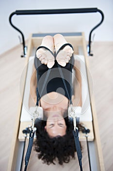 Attractive young lady doing pilates photo