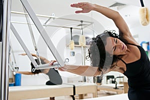 Attractive young lady doing pilates