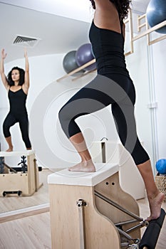 Attractive young lady doing pilates