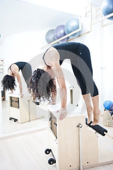 Attractive young lady doing pilates photo