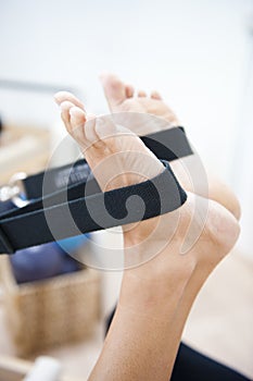 Attractive young lady doing pilates