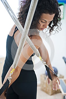 Attractive young lady doing pilates