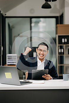 Attractive young lawyer in office Business man and lawyers discussing contract papers laptop and tablet with brass scale on desk