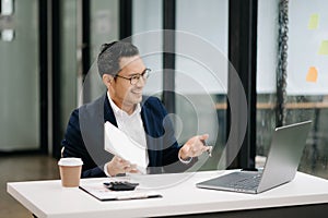 Attractive young lawyer in office Business man and lawyers discussing contract papers laptop and tablet with brass scale on desk