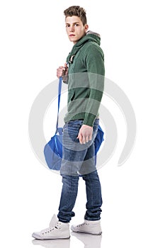 Attractive young man with bag on shoulder strap