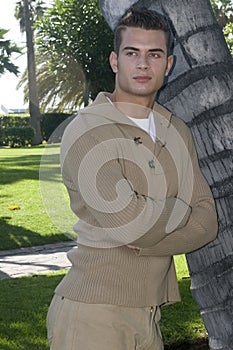 attractive young man in casual clothes outdoors