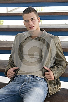 attractive young man in casual clothes outdoors