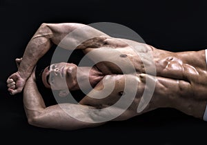 Attractive young man on the floor with muscular ripped body