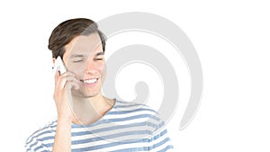 Attractive young man laughing talking on phone , isolated white background