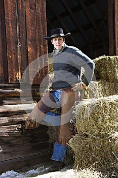 Attractive Young Man Leaning on Hay Bales