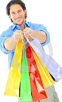 Attractive Young Man Offering Shopping Bags