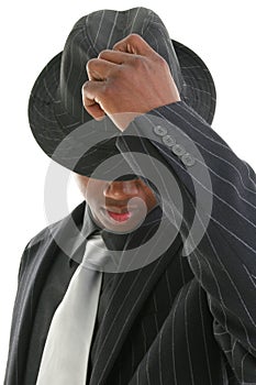 Attractive Young Man In Pinstripe Suit Tipping His Hat