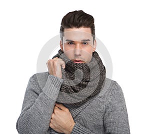 Attractive young man posing with gray wool scarf