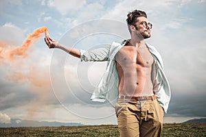 Attractive young man posing outdooor photo