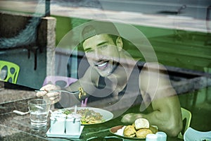 Attractive Young Man`s Breakfast, Eating Salad at Diner