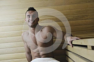 Attractive young man in sauna