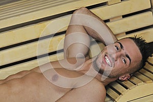 Attractive young man in sauna