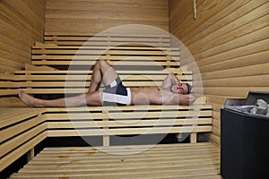 Attractive young man in sauna