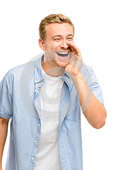 Attractive young man shouting - isolated on white background