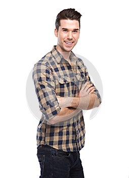 Attractive young man smiling with arms crossed