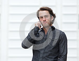 Attractive young man talking on cellphone