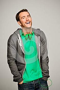 Attractive young man wearing hoodie smiling