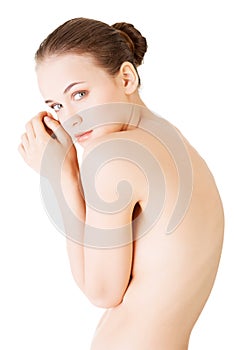 Attractive young naked woman. Side view.