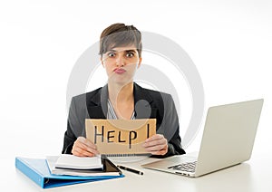 Attractive young overwhelmed and frustrated business woman working on her computer asking for help