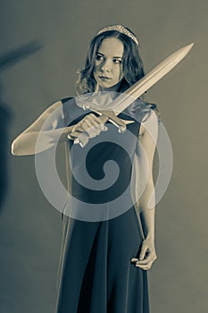 Attractive young pure princess girl with a sword