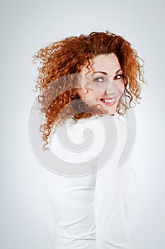 Attractive young redhead woman smiling portrait