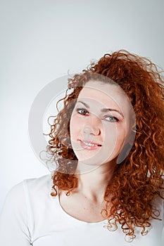 Attractive young redhead woman smiling portrait