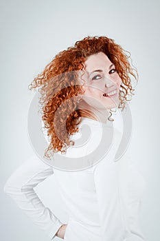 Attractive young redhead woman smiling portrait