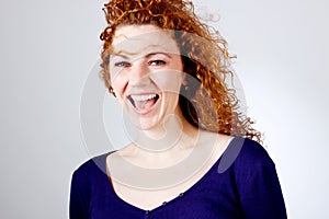 Attractive young redhead woman smiling portrait