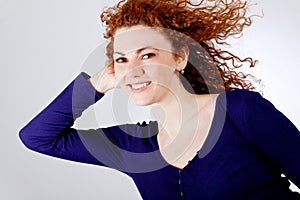 Attractive young redhead woman smiling portrait