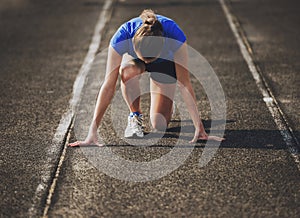 Attractive Young Sporty Girl Ready to Run Sprint.