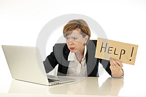 Attractive young tired and frustrated business woman working on her computer asking for help