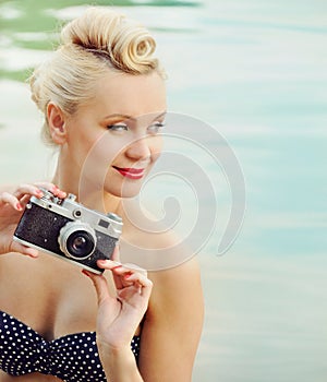 Attractive young woman on the beach with vintage details, travel