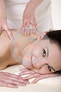 Attractive young woman being massaged