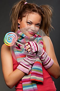 Attractive young woman with candy