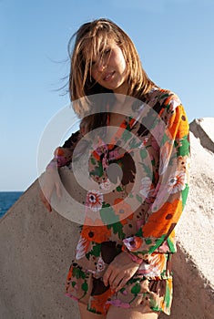 Attractive young woman in a coastal environment near the sea