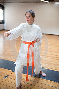 Attractive young woman in combative position