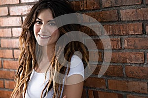 Attractive young woman with dreadlock hair