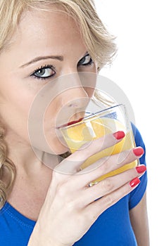 Attractive Young Woman Drinking Orange Juice