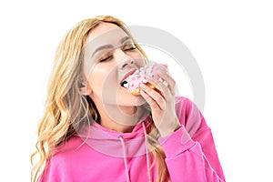 Attractive young woman eating doughnut