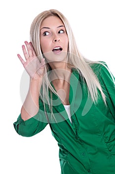 Attractive young woman eavesdropping - isolated on White.