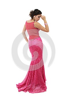 Attractive young woman in elegant pink dress