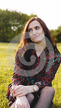 Attractive young woman enjoying her time outside in park