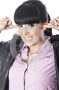 Attractive Young Woman With Fingers in Hers Ears So She Cannot Her Any Noise