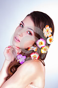 Attractive young woman with flowers in hair